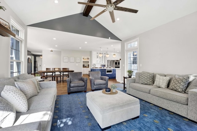 7270 Bannockburn Cir, Lakewood, IL 60014 - living area featuring plenty of natural light, high vaulted ceiling, a ceiling fan, beam ceiling, and recessed lighting