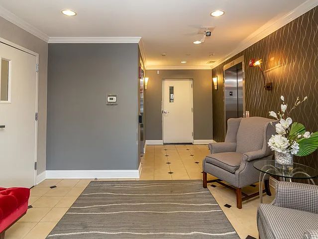 77 N Quentin Rd Unit 202, Palatine, IL 60067 - foyer entrance with ornamental molding, elevator, light tile patterned floors, and recessed lighting