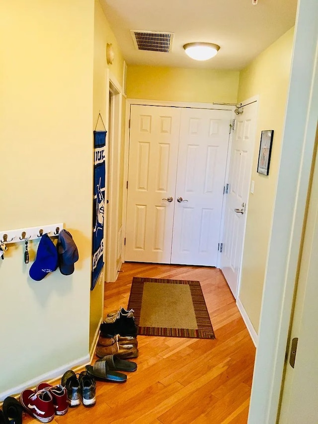 77 N Quentin Rd Unit 202, Palatine, IL 60067 - hallway with light wood finished floors
