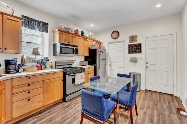 2629 W Evergreen Ave, Chicago, IL 60622 - kitchen with stainless steel appliances, light wood-type flooring, light countertops, and recessed lighting