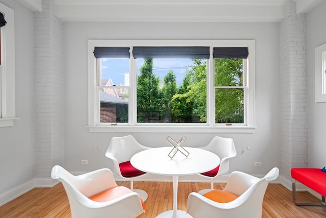 343 Washington Ave, Wilmette, IL 60091 - dining room featuring light wood finished floors and brick wall