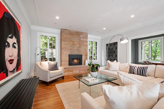 343 Washington Ave, Wilmette, IL 60091 - living area with healthy amount of natural light, a stone fireplace, light wood finished floors, recessed lighting, and crown molding