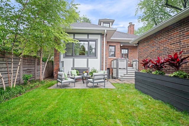 343 Washington Ave, Wilmette, IL 60091 - rear view of property with outdoor lounge area, a chimney, brick siding, and a patio area
