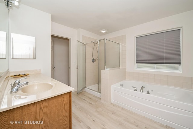 646 Grand Canyon Cir, Crystal Lake, IL 60014 - bathroom featuring vanity, a bath, wood finished floors, and a shower stall