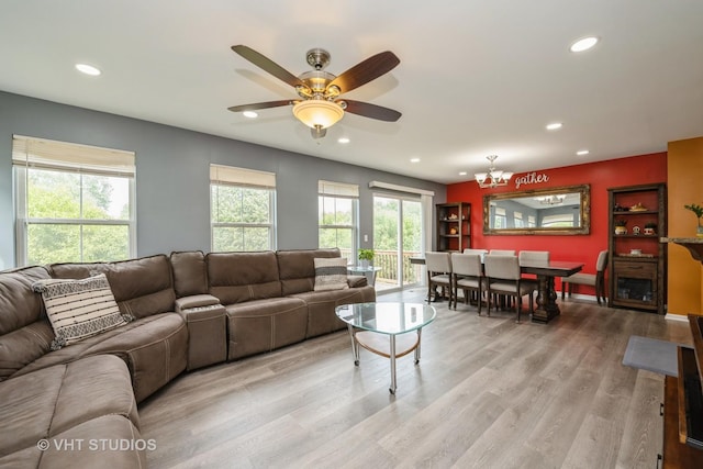 646 Grand Canyon Cir, Crystal Lake, IL 60014 - living room with recessed lighting, light wood-style flooring, a ceiling fan, and a chandelier