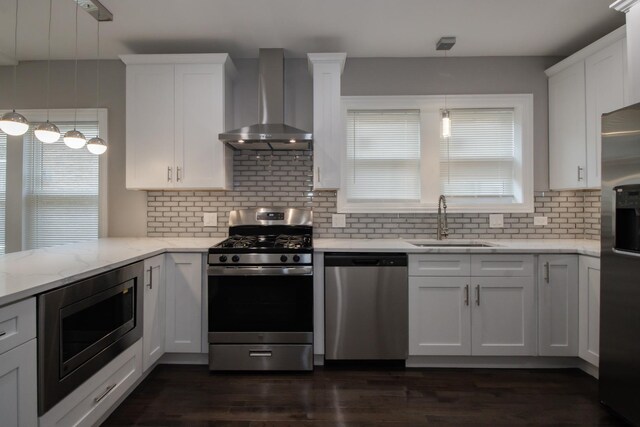 8930 S Throop St, Chicago, IL 60620 - kitchen featuring stainless steel appliances, wall chimney range hood, white cabinetry, tasteful backsplash, and light stone countertops