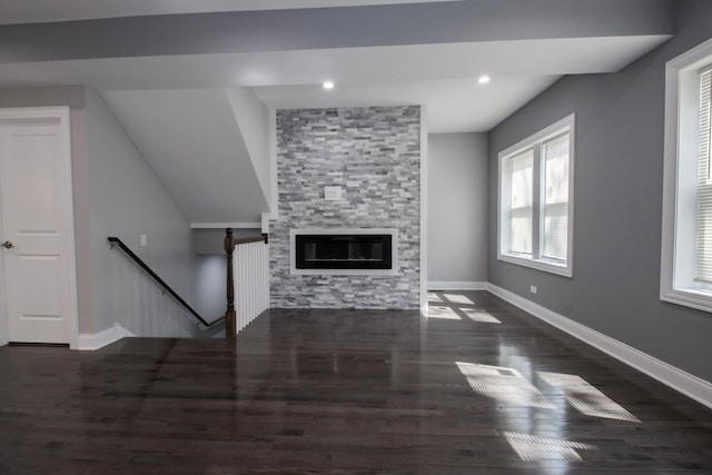 8930 S Throop St, Chicago, IL 60620 - unfurnished living room with wood finished floors, a stone fireplace, and recessed lighting