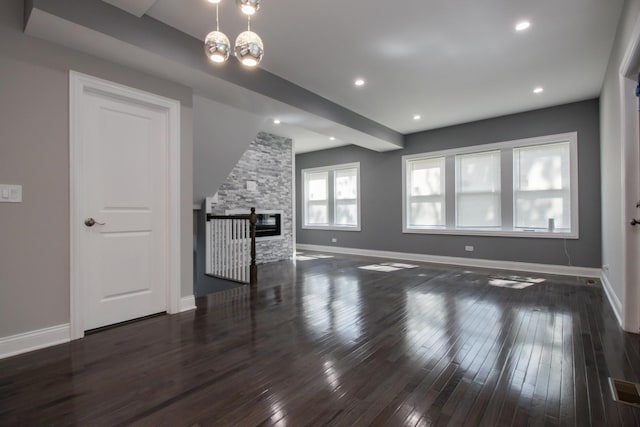 8930 S Throop St, Chicago, IL 60620 - unfurnished living room with wood-type flooring, a fireplace, a chandelier, and recessed lighting