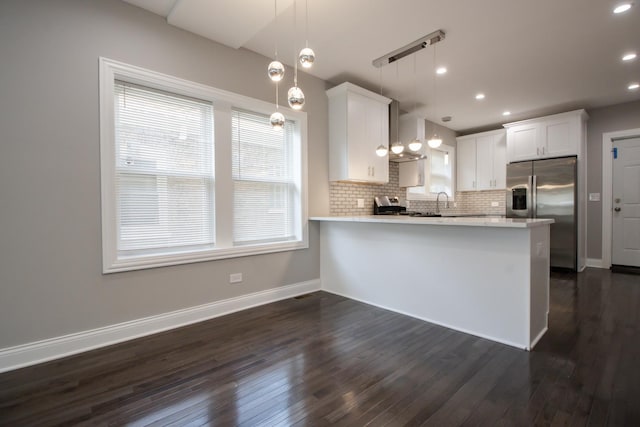 8930 S Throop St, Chicago, IL 60620 - kitchen with appliances with stainless steel finishes, light countertops, dark wood-style floors, a peninsula, and recessed lighting