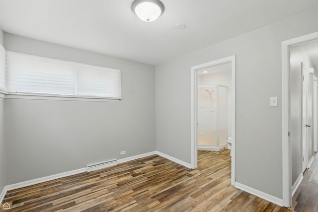 5301 State Rd, Burbank, IL 60459 - unfurnished bedroom featuring wood finished floors and ensuite bathroom