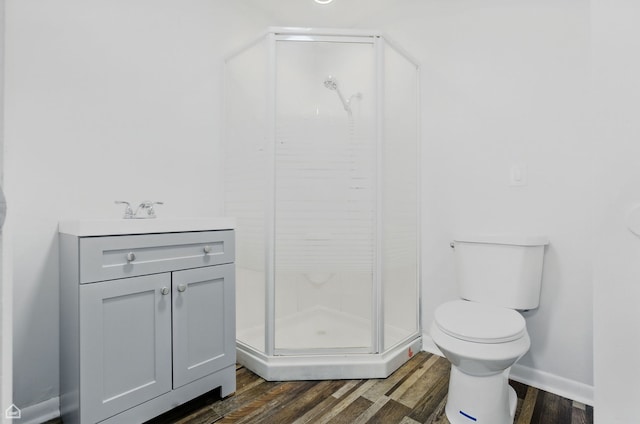 5301 State Rd, Burbank, IL 60459 - full bathroom featuring a stall shower, wood finished floors, and vanity