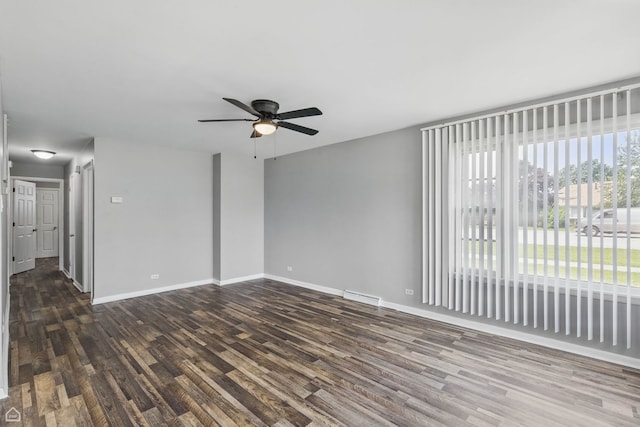 5301 State Rd, Burbank, IL 60459 - spare room featuring dark wood finished floors, healthy amount of natural light, and ceiling fan