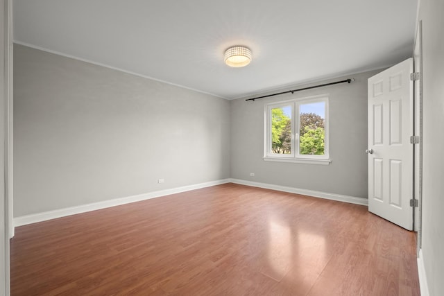 5332 N Delphia Ave Unit 108, Chicago, IL 60656 - unfurnished room with light wood-style floors and ornamental molding
