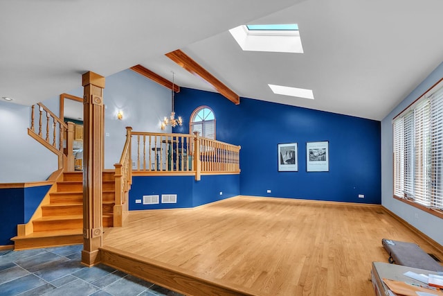 11254 S Whipple St, Chicago, IL 60655 - unfurnished living room with a skylight, stairs, and a chandelier