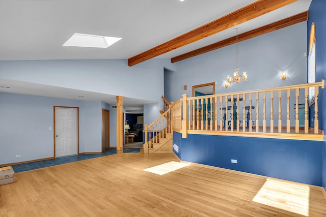 11254 S Whipple St, Chicago, IL 60655 - spare room with wood finished floors, stairs, a skylight, beam ceiling, and a chandelier