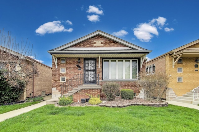 5836 S Menard Ave, Chicago, IL 60638 - view of front facade featuring brick siding, a front yard, and stairway