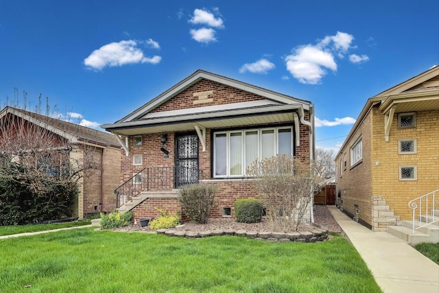 5836 S Menard Ave, Chicago, IL 60638 - view of front facade featuring brick siding, a front lawn, and stairway