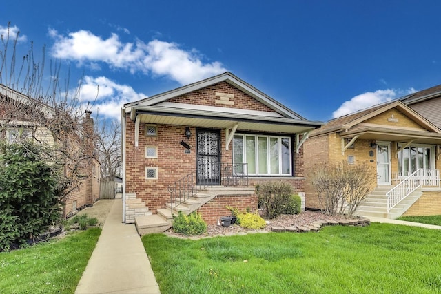 5836 S Menard Ave, Chicago, IL 60638 - view of front of house featuring covered porch, brick siding, stairs, and a front lawn