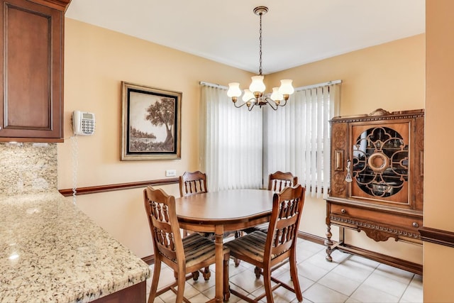 5836 S Menard Ave, Chicago, IL 60638 - dining area featuring a chandelier and baseboards