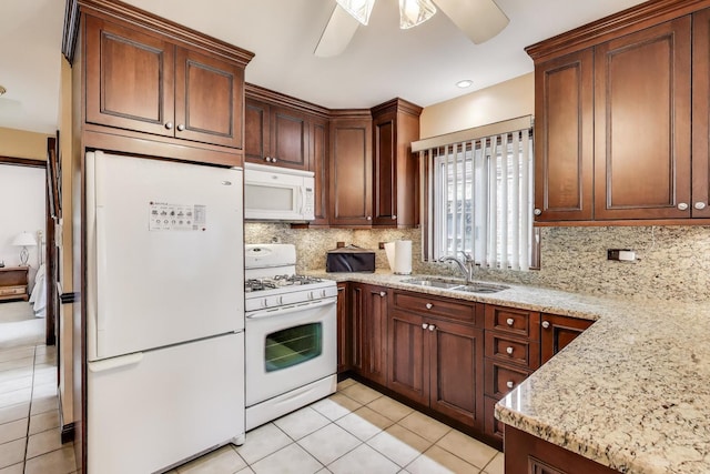 5836 S Menard Ave, Chicago, IL 60638 - kitchen with white appliances, ceiling fan, backsplash, and light tile patterned flooring