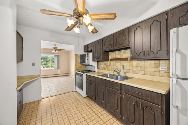 1139 Leavitt Ave Unit 313, Flossmoor, IL 60422 - kitchen with white appliances, dark brown cabinets, decorative backsplash, ceiling fan, and light countertops