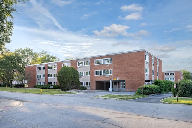 1139 Leavitt Ave Unit 313, Flossmoor, IL 60422 - view of building exterior with an attached garage and driveway