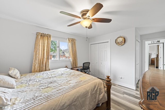 8825 Abbey Ln, Orland Park, IL 60462 - bedroom featuring light wood-style flooring, ceiling fan, and a closet