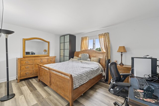 8825 Abbey Ln, Orland Park, IL 60462 - bedroom featuring light wood finished floors and a desk