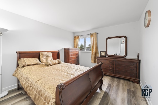 8825 Abbey Ln, Orland Park, IL 60462 - bedroom featuring wood finished floors and baseboards