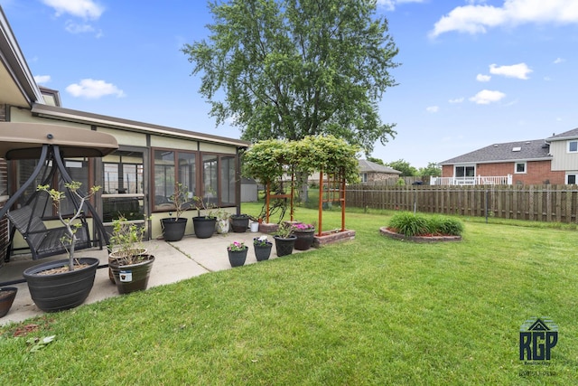 8825 Abbey Ln, Orland Park, IL 60462 - fenced backyard with a sunroom and a patio area