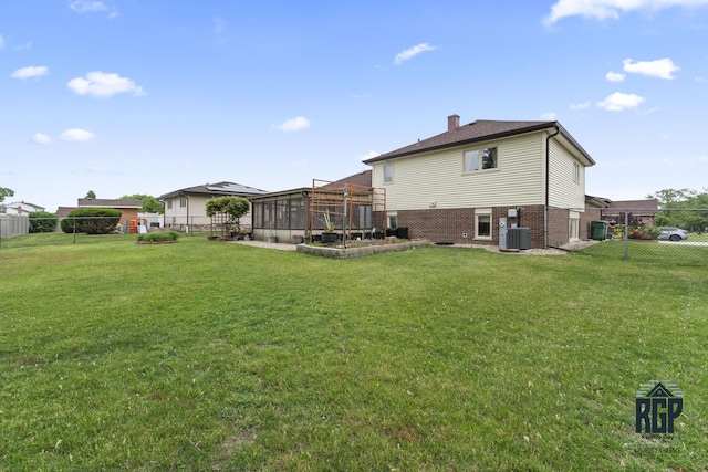 8825 Abbey Ln, Orland Park, IL 60462 - back of house with a chimney, a fenced backyard, and brick siding