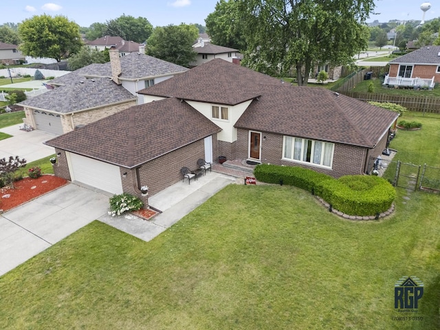 8825 Abbey Ln, Orland Park, IL 60462 - view of front of property with brick siding, concrete driveway, an attached garage, and a shingled roof