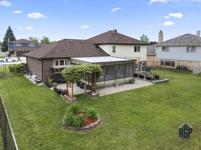 8825 Abbey Ln, Orland Park, IL 60462 - back of house with a sunroom, a fenced backyard, and roof with shingles