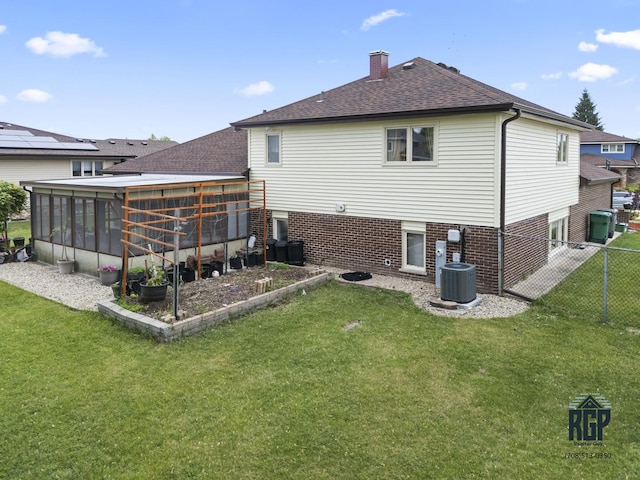 8825 Abbey Ln, Orland Park, IL 60462 - back of property with a sunroom, a chimney, and roof with shingles