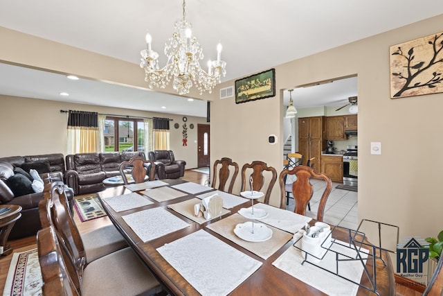 8825 Abbey Ln, Orland Park, IL 60462 - dining room featuring a chandelier, recessed lighting, light tile patterned flooring, and ceiling fan