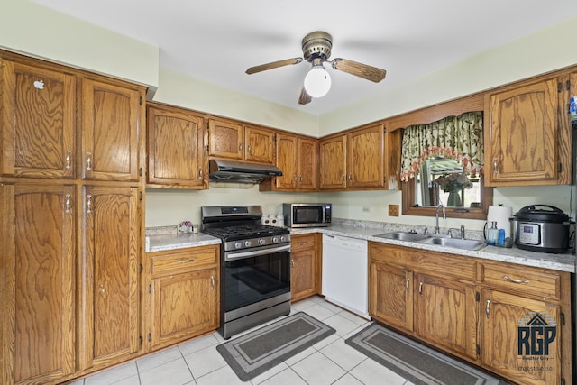 8825 Abbey Ln, Orland Park, IL 60462 - kitchen featuring stainless steel appliances, under cabinet range hood, brown cabinets, light countertops, and ceiling fan