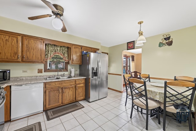 8825 Abbey Ln, Orland Park, IL 60462 - kitchen with appliances with stainless steel finishes, light countertops, and brown cabinetry