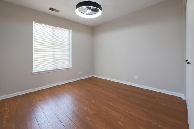 1653 Geneva Dr, Wheeling, IL 60090 - spare room with baseboards and dark wood finished floors