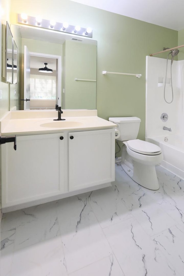 1653 Geneva Dr, Wheeling, IL 60090 - bathroom with vanity, shower / washtub combination, and marble finish floors