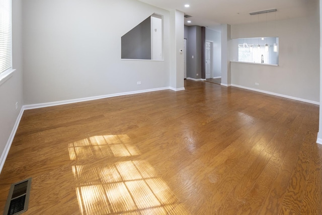 1653 Geneva Dr, Wheeling, IL 60090 - empty room with wood finished floors and recessed lighting
