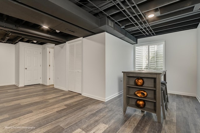 26065 S White Oak Trl, Channahon, IL 60410 - below grade area featuring baseboards and wood finished floors