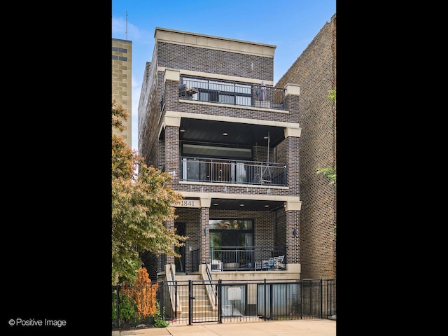 1841 N Sheffield Ave Unit 2, Chicago, IL 60614 - rear view of house featuring a balcony and brick siding