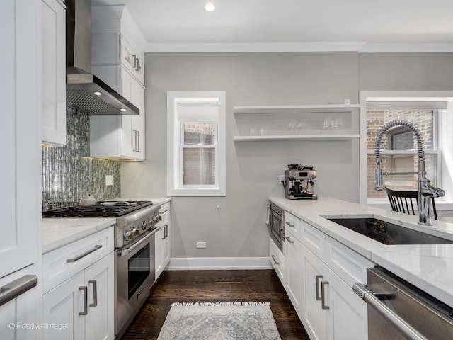 1841 N Sheffield Ave Unit 2, Chicago, IL 60614 - kitchen featuring wall chimney exhaust hood, appliances with stainless steel finishes, light stone counters, decorative backsplash, and healthy amount of natural light