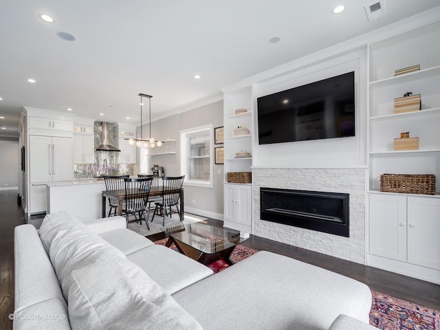1841 N Sheffield Ave Unit 2, Chicago, IL 60614 - living room with dark wood-style flooring, recessed lighting, ornamental molding, a fireplace, and built in features