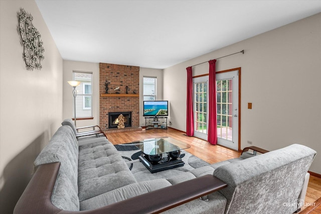 1348 Amaranth Dr, Naperville, IL 60564 - living room featuring wood finished floors and a brick fireplace