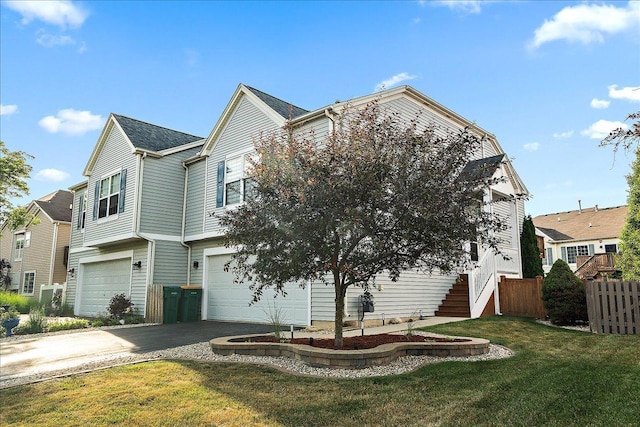 2447 Saddle Ridge Dr, Joliet, IL 60432 - view of front of property featuring driveway, a garage, and stairway