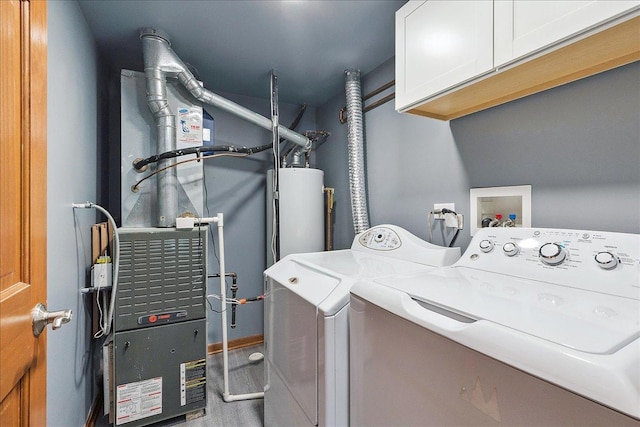 2447 Saddle Ridge Dr, Joliet, IL 60432 - laundry area featuring independent washer and dryer, cabinet space, and water heater