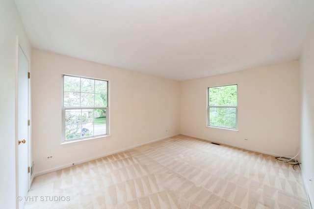 1257 Ballantrae Pl Unit C, Mundelein, IL 60060 - empty room featuring light carpet and baseboards