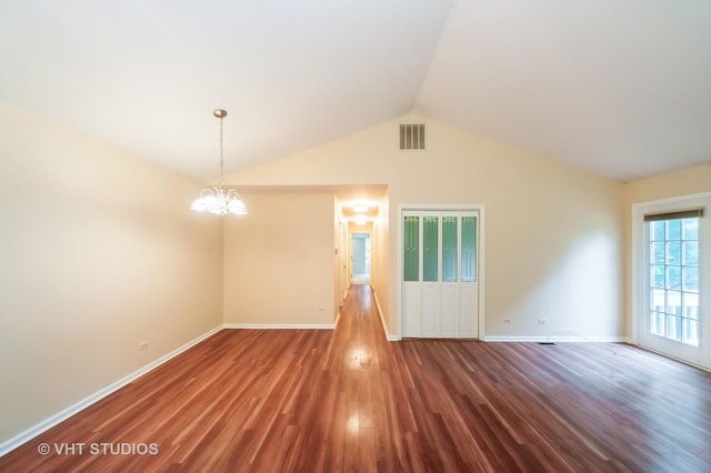 1257 Ballantrae Pl Unit C, Mundelein, IL 60060 - empty room featuring wood finished floors, a chandelier, and vaulted ceiling