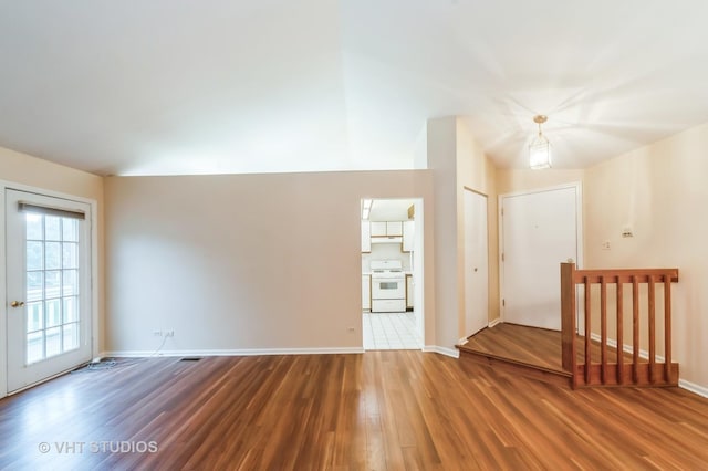 1257 Ballantrae Pl Unit C, Mundelein, IL 60060 - spare room featuring wood finished floors and baseboards